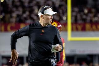 LOS ANGELES, CA - OCTOBER 7, 2023: USC Trojans head coach Lincoln Riley calls an offensive play.