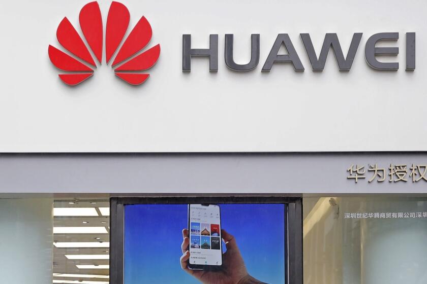 A logo of Huawei is displayed at a shop in Shenzhen, China's Guangdong province, Thursday, March 7, 2019. Chinese tech giant Huawei is challenging a U.S. law that labels the company a security risk and would limit its access to the American market for telecom equipment. (AP Photo/Kin Cheung)