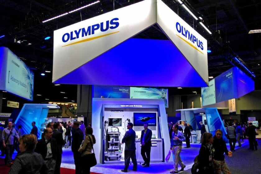 Olympus Corp. reported strong sales of its medical scopes despite recent superbug outbreaks and an ongoing federal investigation. Above, the company's booth at a Washington conference in May.