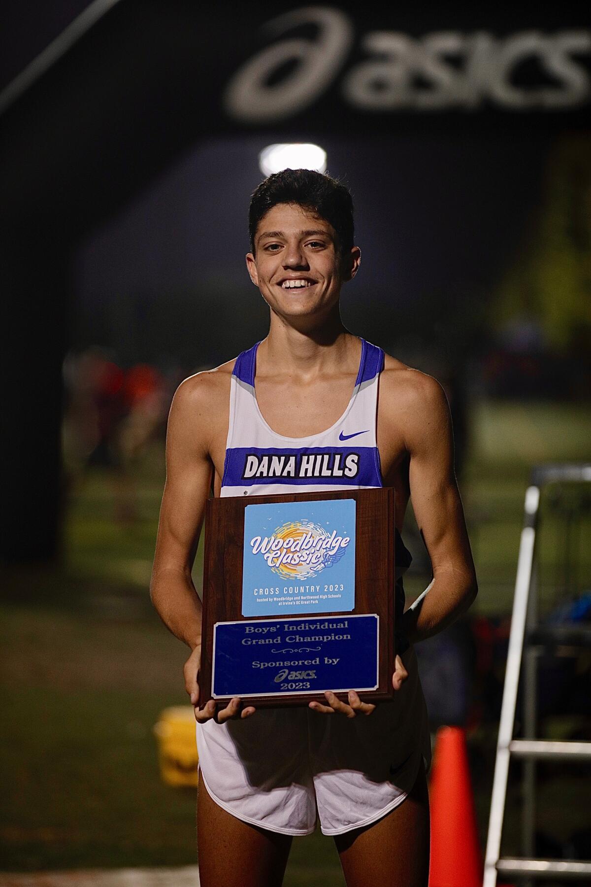 Evan Noonan of Dana Hills High won the boys' aweepstakes race in 13:41.3 at the Woodbridge Classic on Saturday in Irvine.