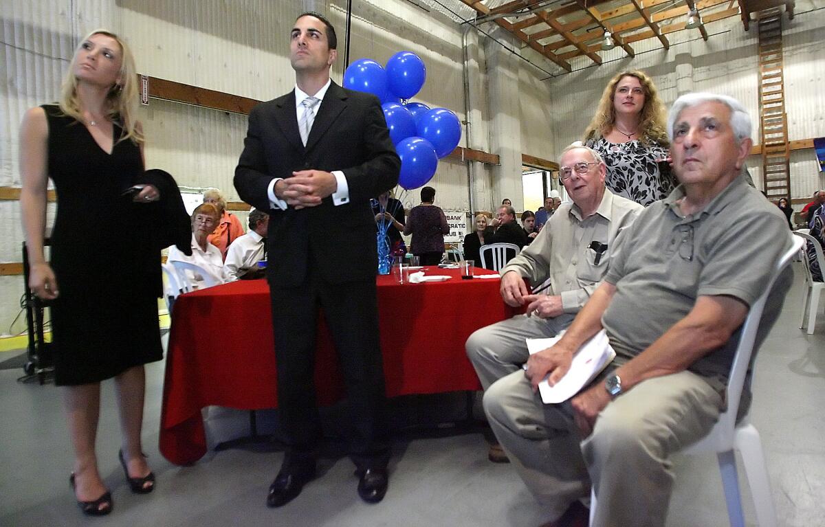 File Photo: Campaign manager Stacey Brenner, Assemblyman Mike Gatto and Ken Ahern and father Joseph Gatto listen to early returns on other races and propositions at an election party in Burbank on Tuesday, June 8, 2010. The assemblyman's father, Joseph Gatto, was shot and killed in an apparent home invasion robbery on Wednesday, Nov. 13, 2013.