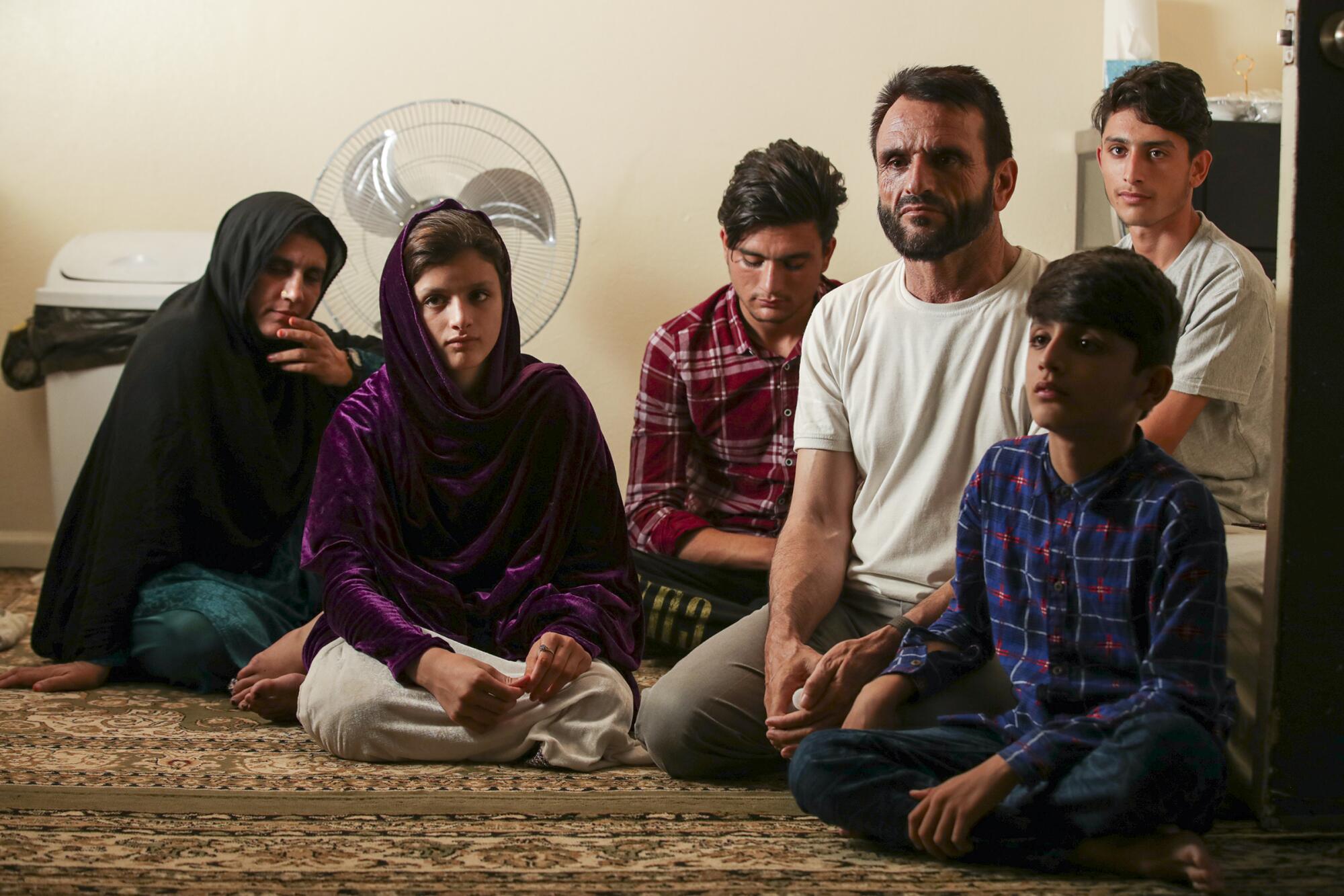 Afghan refugee family of six is forced to live with another family of five in a small one bedroom apartment