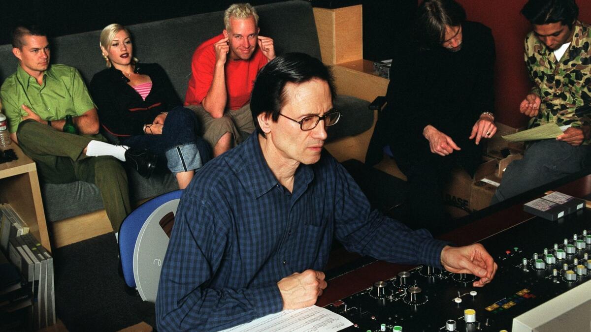 Grundman in his studio with the members of No Doubt in 1999.