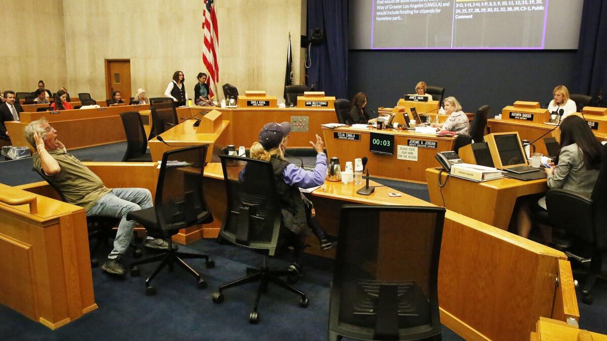 Community members address the Los Angeles County Board of Supervisors during its meeting at the Kenneth Hahn Hall of Administration on April 9.