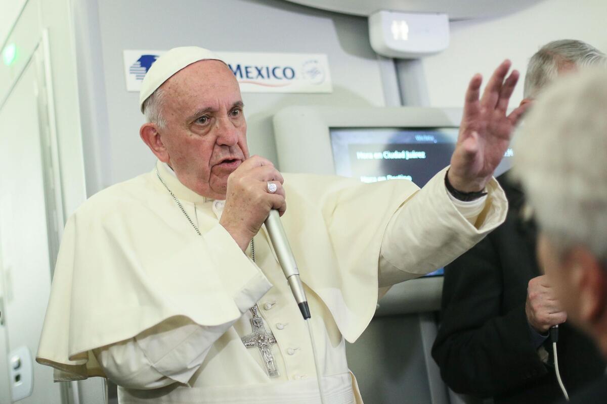Pope Francis speaks to journalists aboard a flight from Mexico to Italy on Feb. 18, 2016.