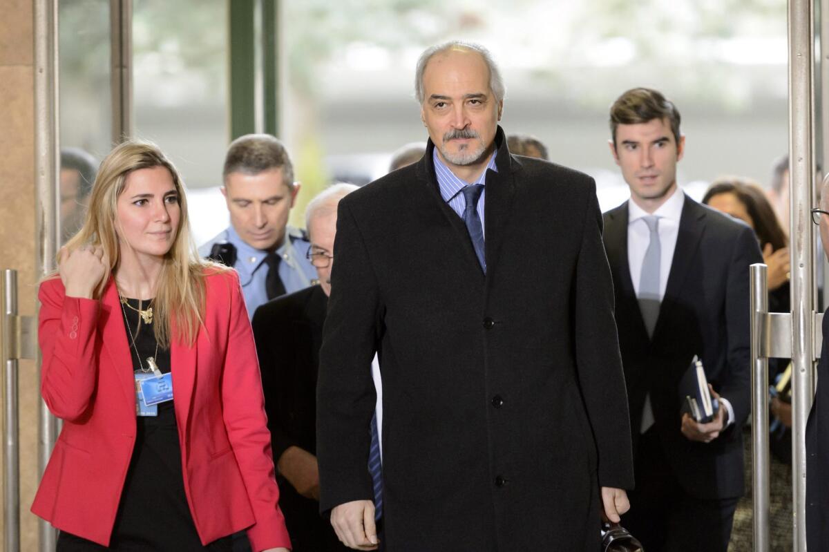 The Syrian government's chief negotiator, Bashar Jaafari, center, arrives for talks with U.N. peace envoy Staffan de Mistura at the European headquarters of the United Nations in Geneva on Feb. 2, 2016.