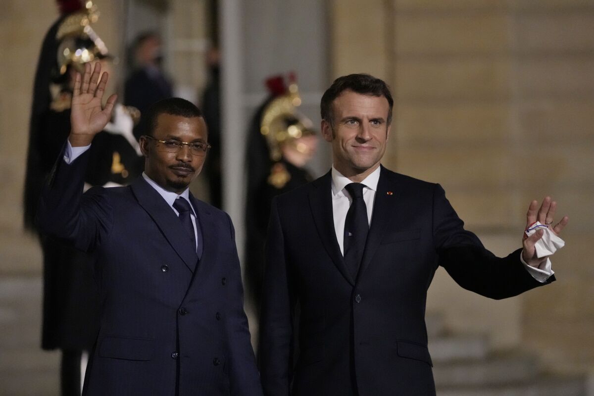 France's President Emmanuel Macron, right welcomes Chad's President Mahamat Idriss Deby for a meeting at the Elysee Palace, in Paris, France, Wednesday, Feb. 16, 2022. France is hosting Wednesday a summit on how to fight Islamic extremists in West Africa as Paris is considering withdrawing its troops from Mali while maintaining military operations in the broader Sahel region, the French presidency said. (AP Photo/Francois Mori)