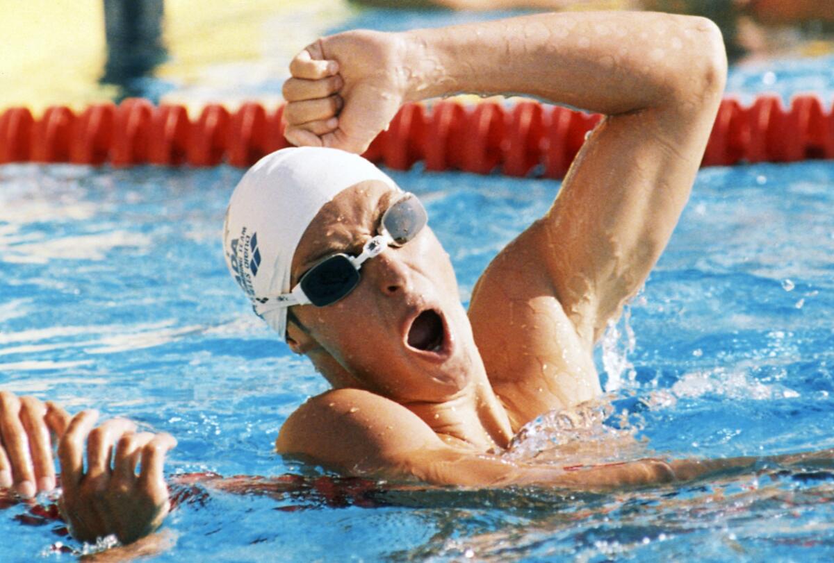 FILE - In this July 30, 1984, file photo Alex Baumann of Canada celebrates after winning the 400 Meter Individual Medley Swimming event, setting a new World Record time of 4:17.41 at the Summer Olympic Games in Los Angeles. Two-time Canadian Olympic gold medalist Baumann has been named chief executive of Swimming Australia, moving up from his current position as chief strategist at the sport's governing body Down Under. (AP Photo/Pete Leabo, File)
