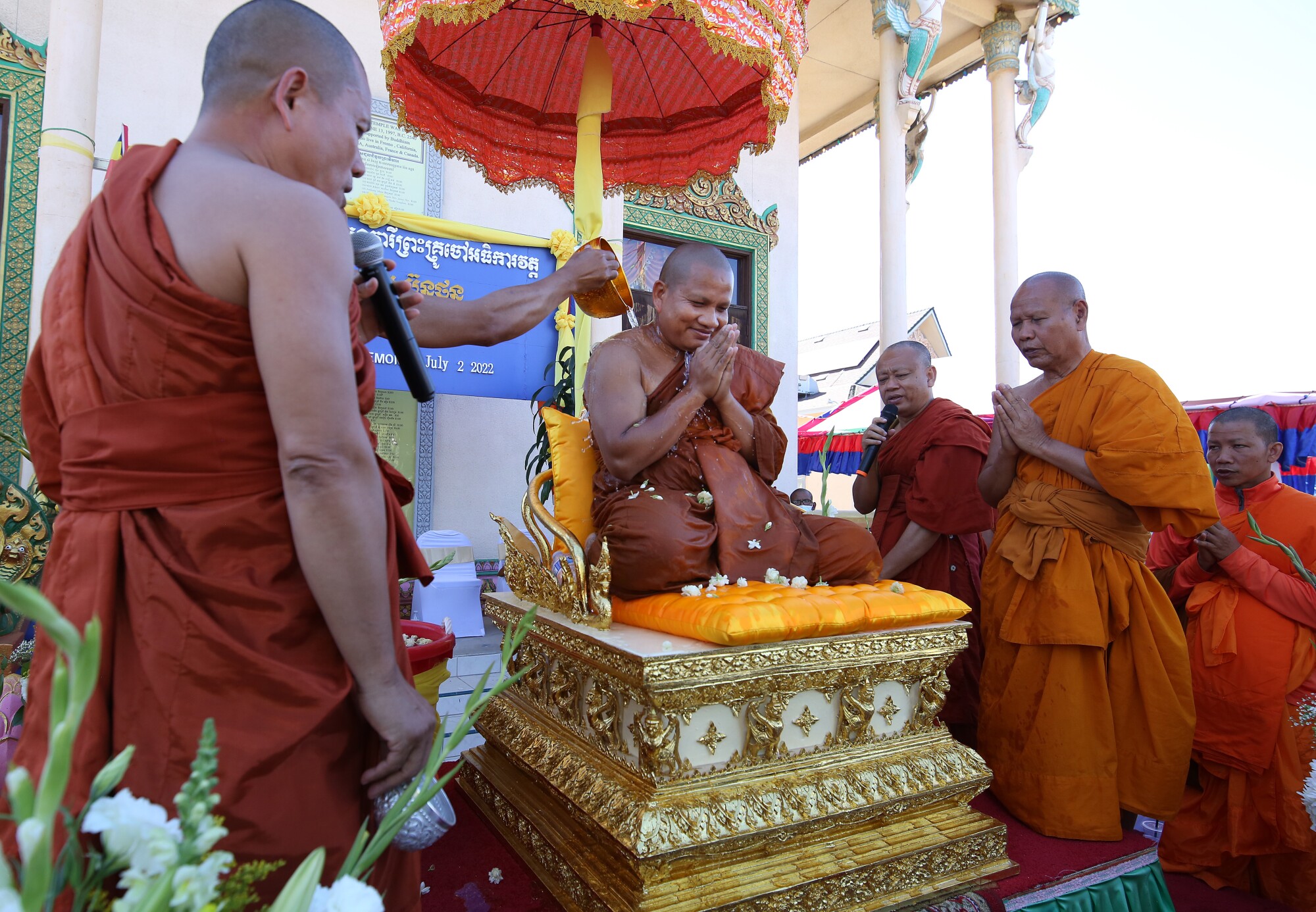Temple abbot Sei Bunton (center) douses himself with holy water during a special ceremony.