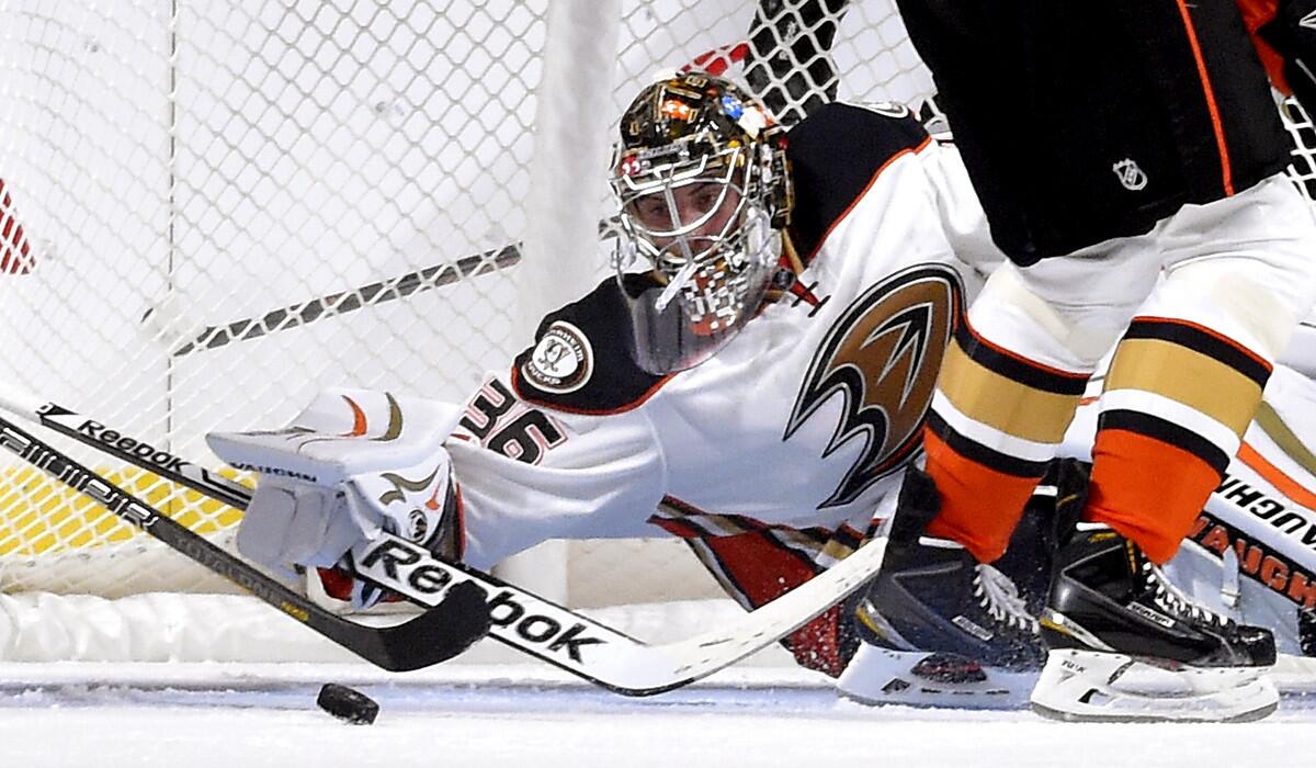 Ducks goalie John Gibson stops a shot during the first period of a preseason game against the Kings at Staples Center on Sept. 25.