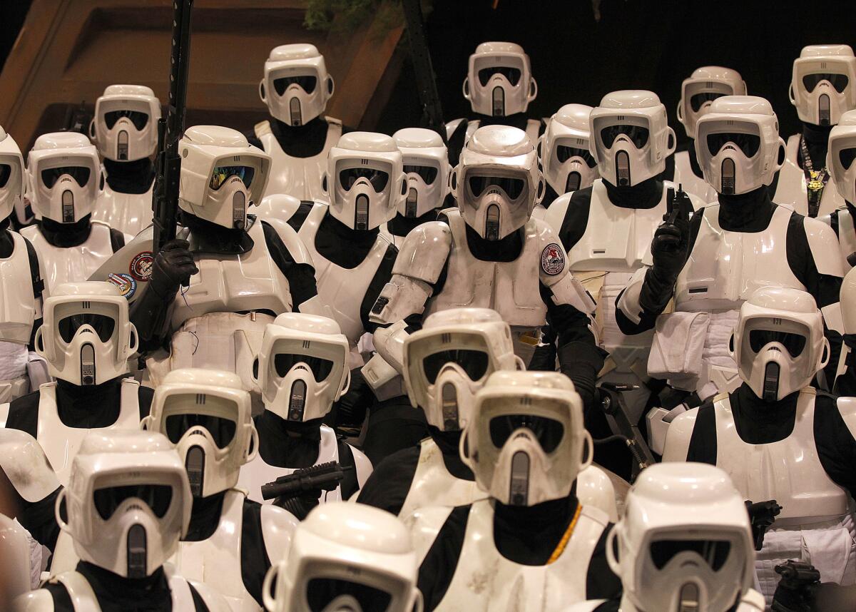 "Star Wars" fans dressed as Stormtroopers take a group photo during the Star Wars Celebration at the Anaheim Convention Center on April 18, 2015.