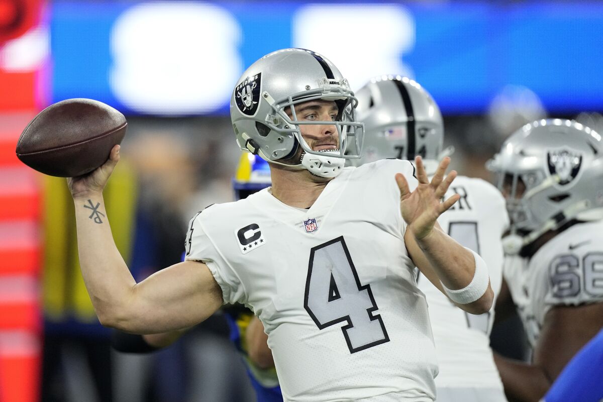 FILE - Las Vegas Raiders quarterback Derek Carr throws a pass during the first half of an NFL football game against the Los Angeles Rams, Dec. 8, 2022, in Inglewood, Calif. Carr said he will not extend the Feb. 15, 2023, deadline to help facilitate a trade from the Raiders. (AP Photo/Mark J. Terrill, File)