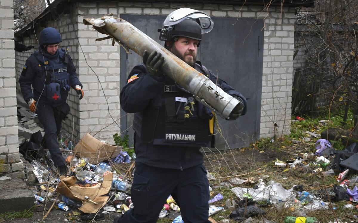 Ukrainian sapper carrying part of a projectile