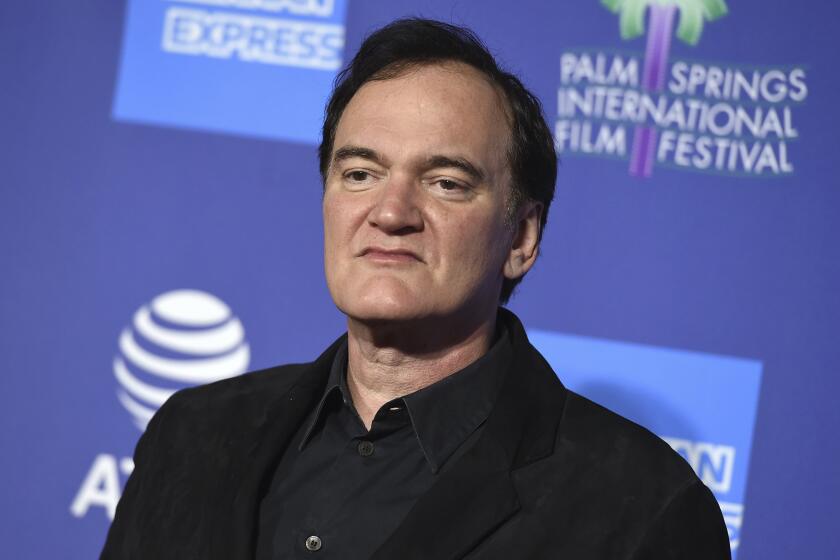 FILE - Quentin Tarantino arrives at the 31st annual Palm Springs International Film Festival Awards Gala on Jan. 2, 2020, in Palm Springs, Calif. The Oscar-winning director has a two-book deal with Harper, beginning with a novelization of "Once Upon a Time ... In Hollywood" that is scheduled for next summer. (Photo by Jordan Strauss/Invision/AP, File)