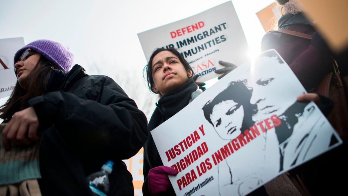 Immigrants and activists protest near the White House to demand that the Department of Homeland Security extend temporary protected status for Salvadorans on Monday.