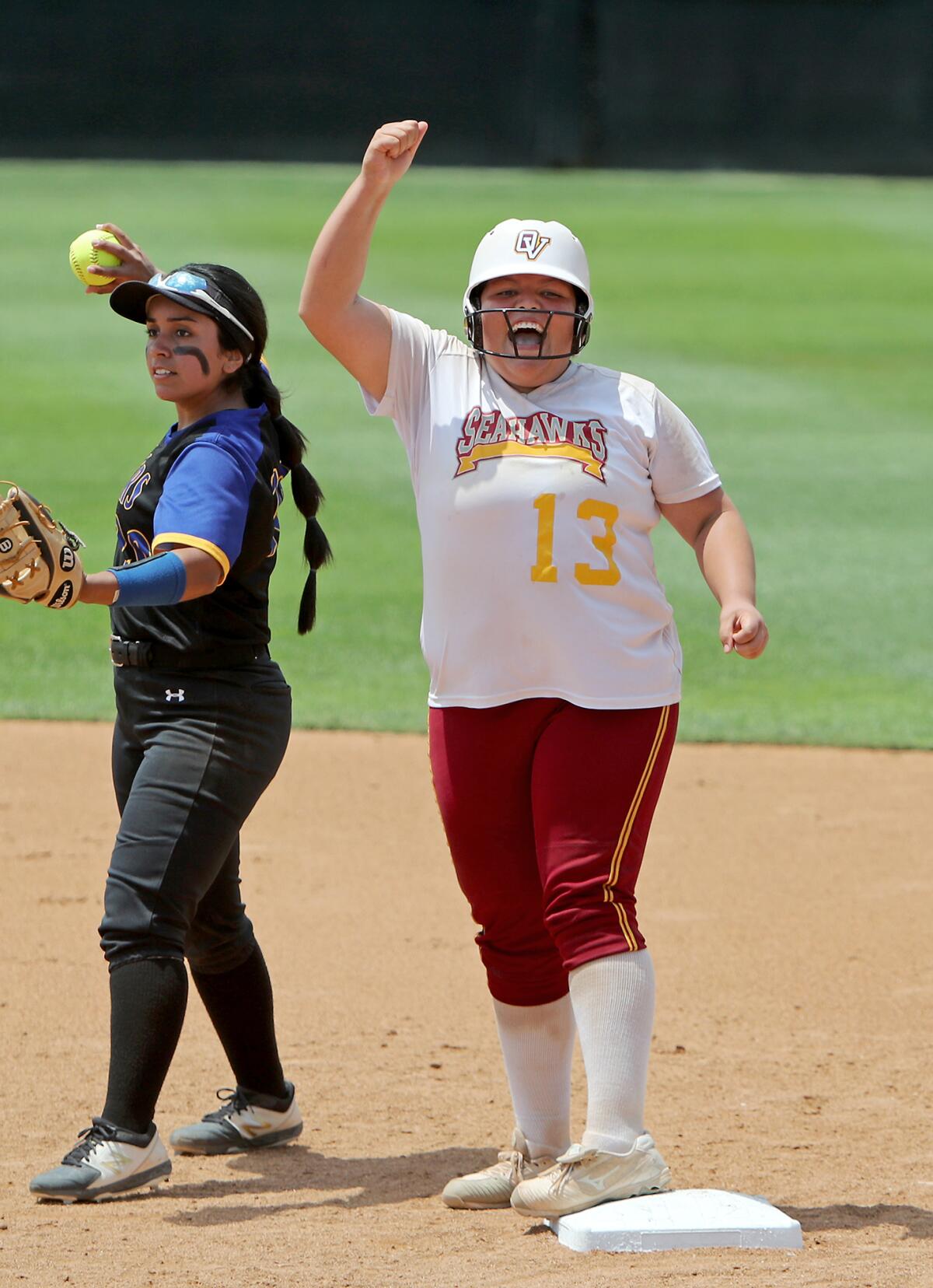 Ocean View senior Nivea Armenta (13) cheers after she hit a double during the seventh inning against Western Christian.