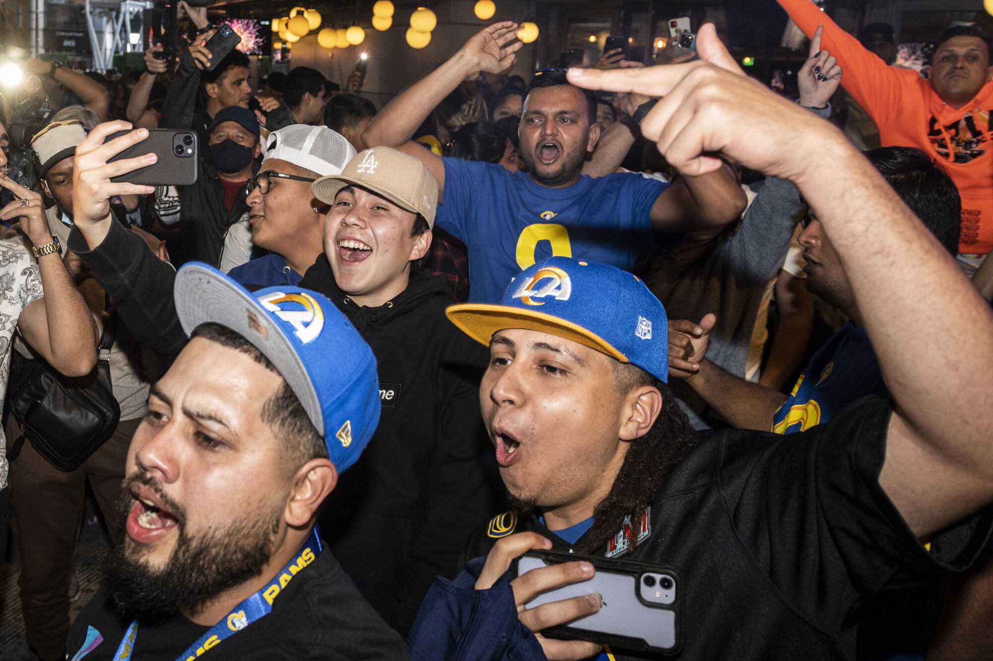 Rams fans celebrate their Super Bowl win over the Bengals at L.A. Live in Downtown Los Angeles.