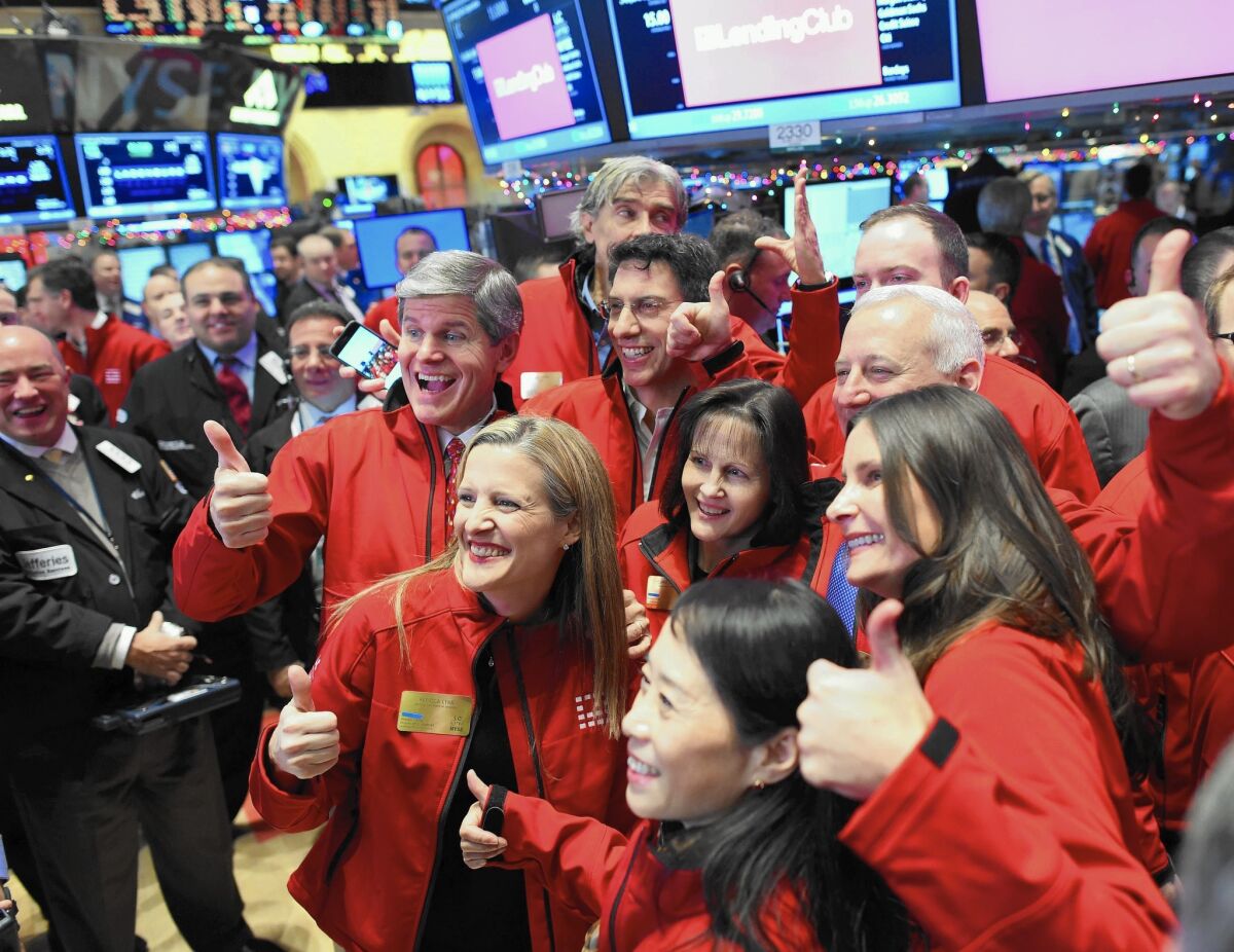 Lending Club executives gather on the floor of the New York Stock Exchange for the company’s IPO.