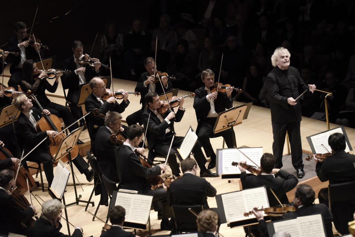 Simon Rattle conducts the Berlin Philharmonic in Mahler Symphony No. 7 at Walt Disney Concert Hall on Saturday night.