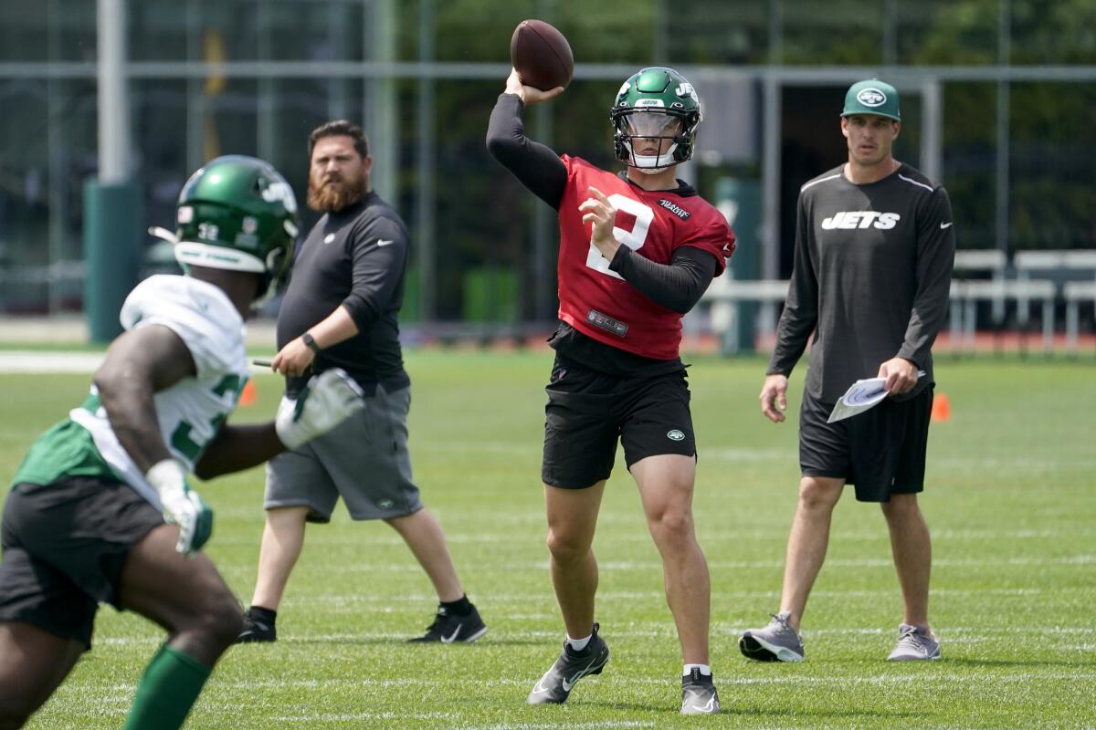 FILE - New York Jets quarterback Zach Wilson (2) takes part in drills at the NFL football team's practice facility, Tuesday, June 14, 2022, in Florham Park, N.J. Rookie quarterback Zach Wilson struggled early last season, and then missed four games with a knee injury. But the No. 2 overall pick bounced back late by throwing no interceptions in his last five games, giving the organization some optimism about the QB's potential for this season. (AP Photo/John Minchillo, File)