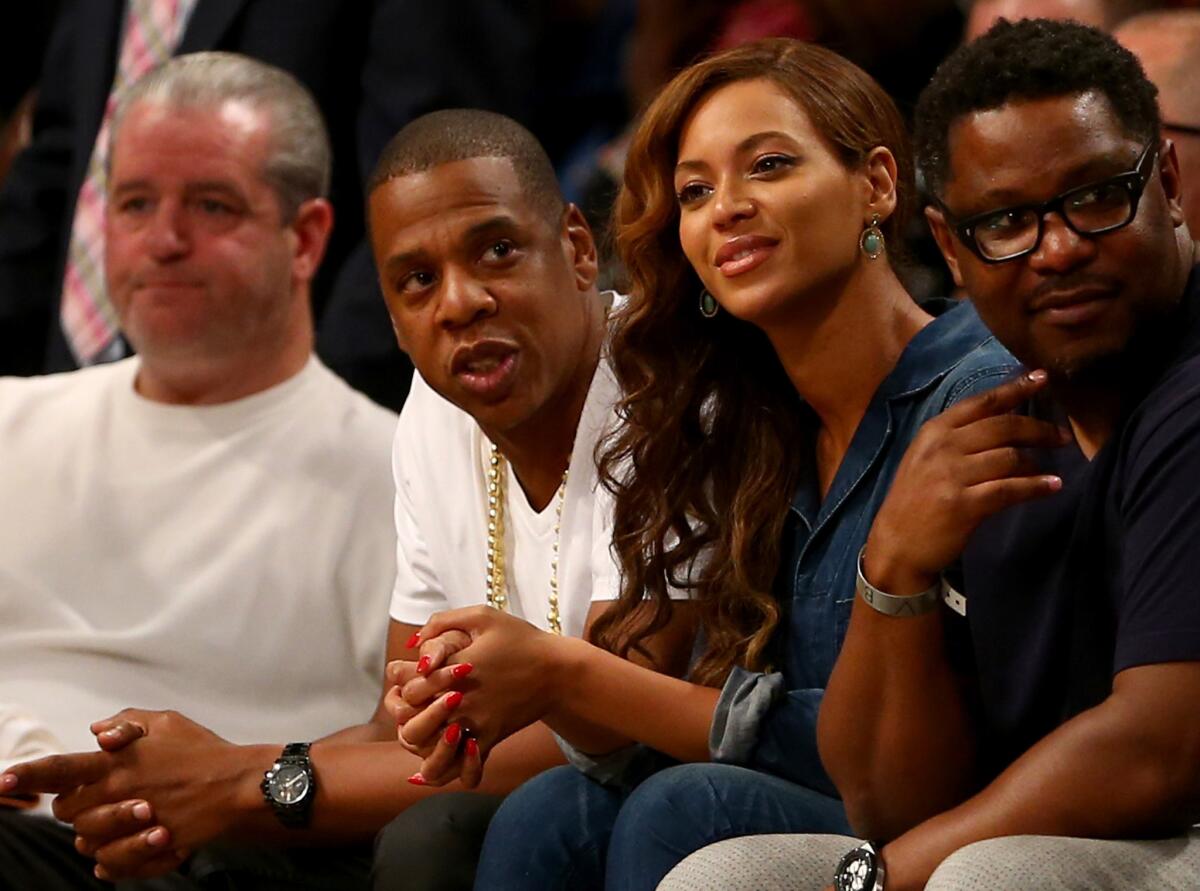 Jay-Z and Beyonce Knowles attend the 2009 NBA All-Star Game held