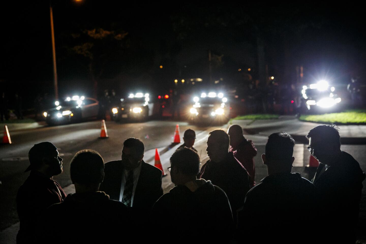 People gather Thursday night on a corner near West Palais Road, near the home of the off-duty LAPD officer involved in a confrontation with teens.