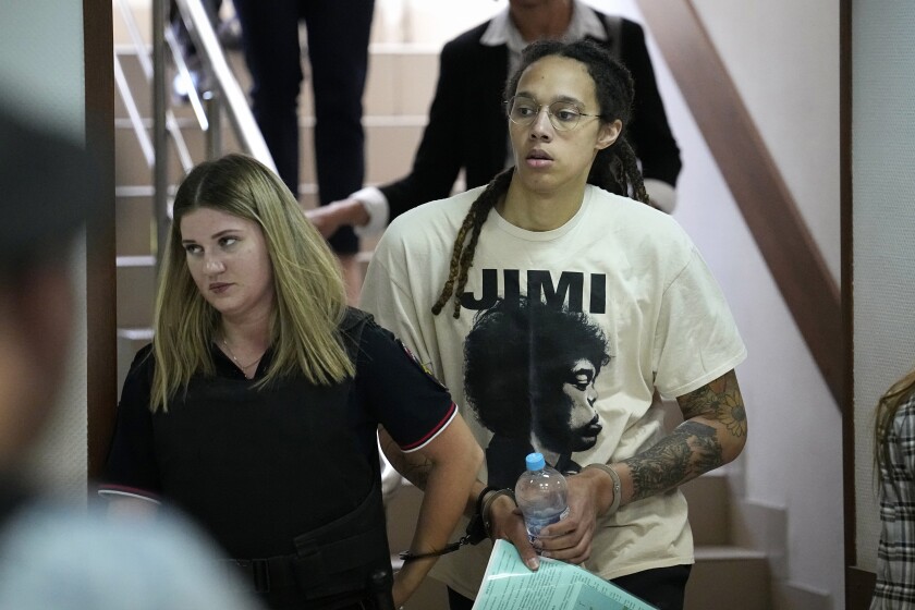 WNBA star Brittney Griner is escorted to a courtroom outside Moscow on Friday.