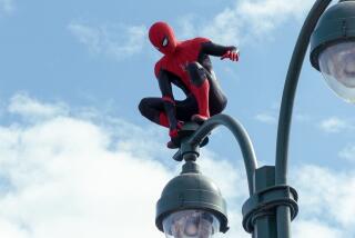 Spider-Man balancing on top of a street lamp