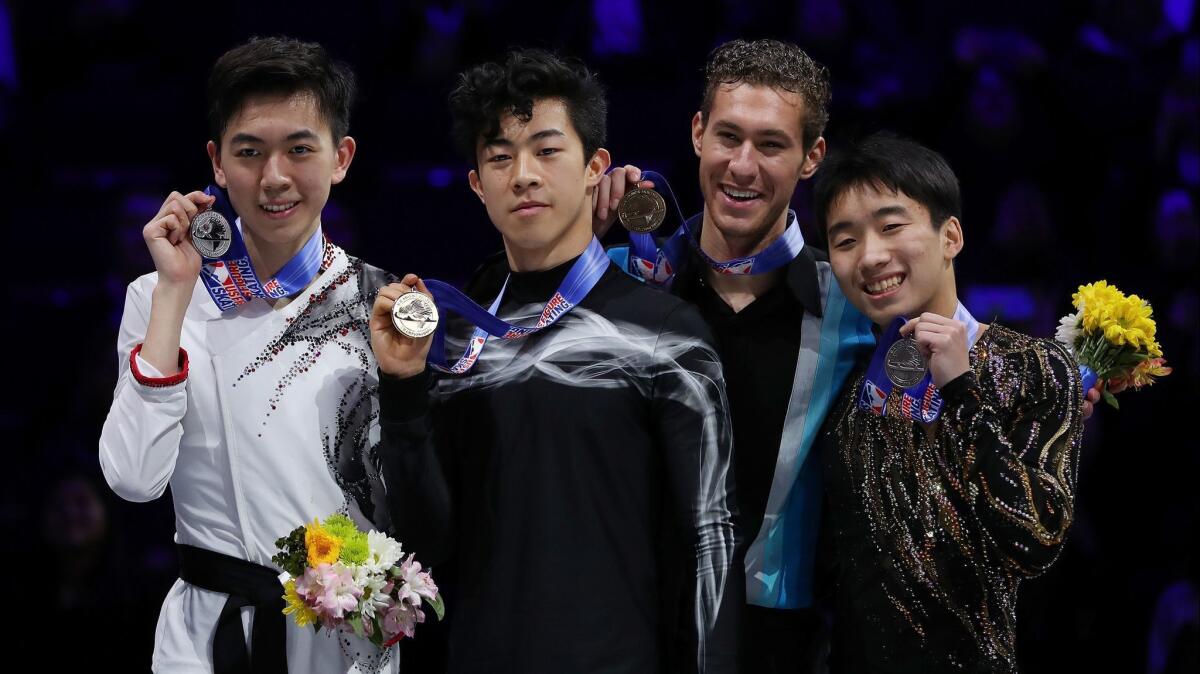 From left to right: Second place Vincent Zhou, champion Nathan Chen, third place Jason Brown and fourth place Tomoki Hiwatashi hold up their medals after the men's free skate during the 2019 U.S. figure skating championships at Little Caesars Arena on Sunday in Detroit.
