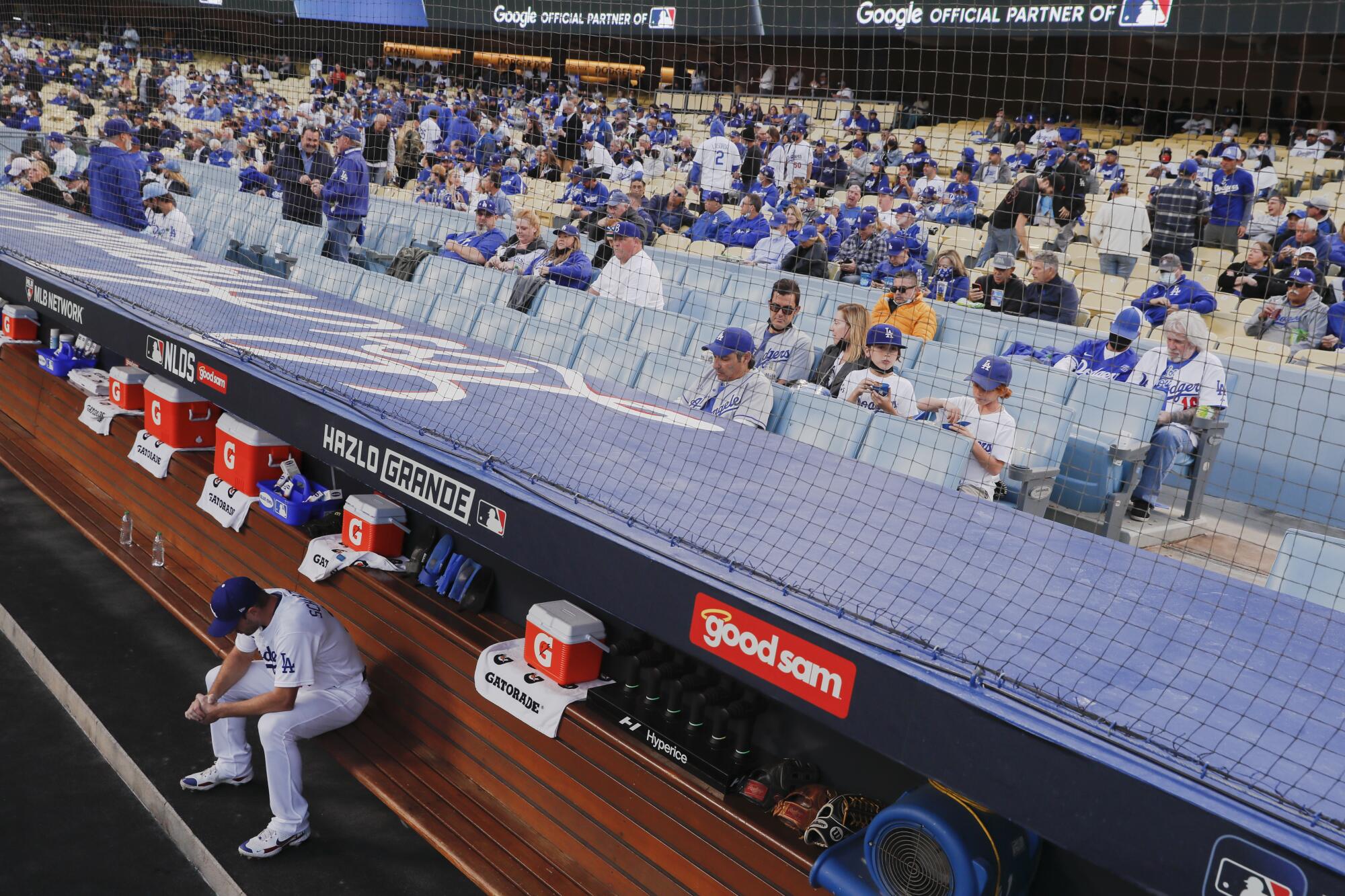  Dodgers' Max Scherzer sits in the dugout.