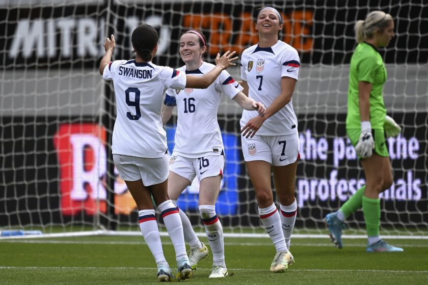 Rose Lavelle of the U.S., second left, celebrates with teammates after scoring against New Zealand during their women's international soccer friendly game in Auckland, New Zealand, Saturday, Jan. 21, 2023. (Andrew Cornaga/Photosport via AP)