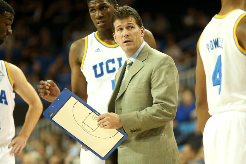UCLA Coach Steve Alford talks to his team during a timeout in a game against UC Riverside on Dec. 10. The Bruins beat the Highlanders, 77-66.