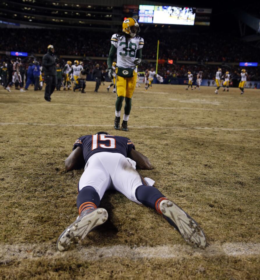 Brandon Marshall lies on the turf at end of 33-28 loss to the Packers.
