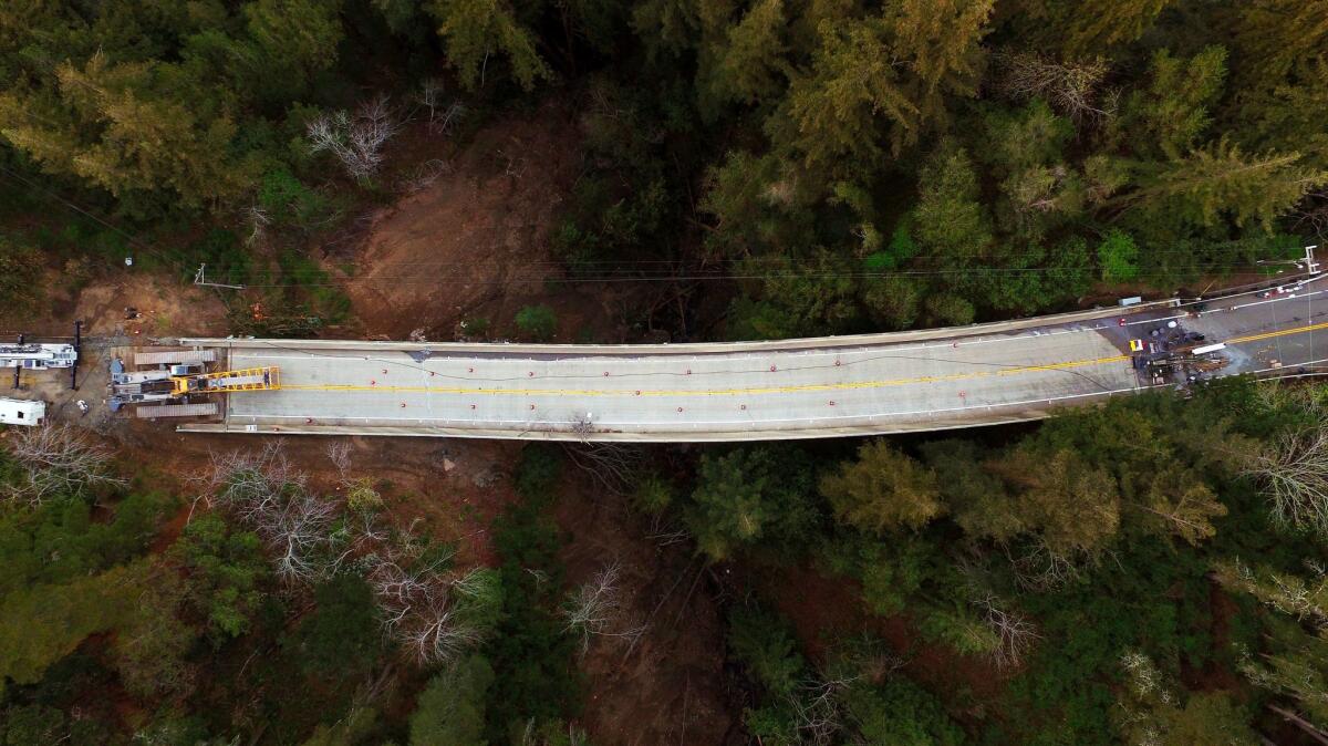 The Pfeiffer Canyon Bridge on Highway 1 buckled and slid because of heavy rains in mid-February. The bridge, shown here March 8, has left a gap in the roadway until a replacement bridge can be built.
