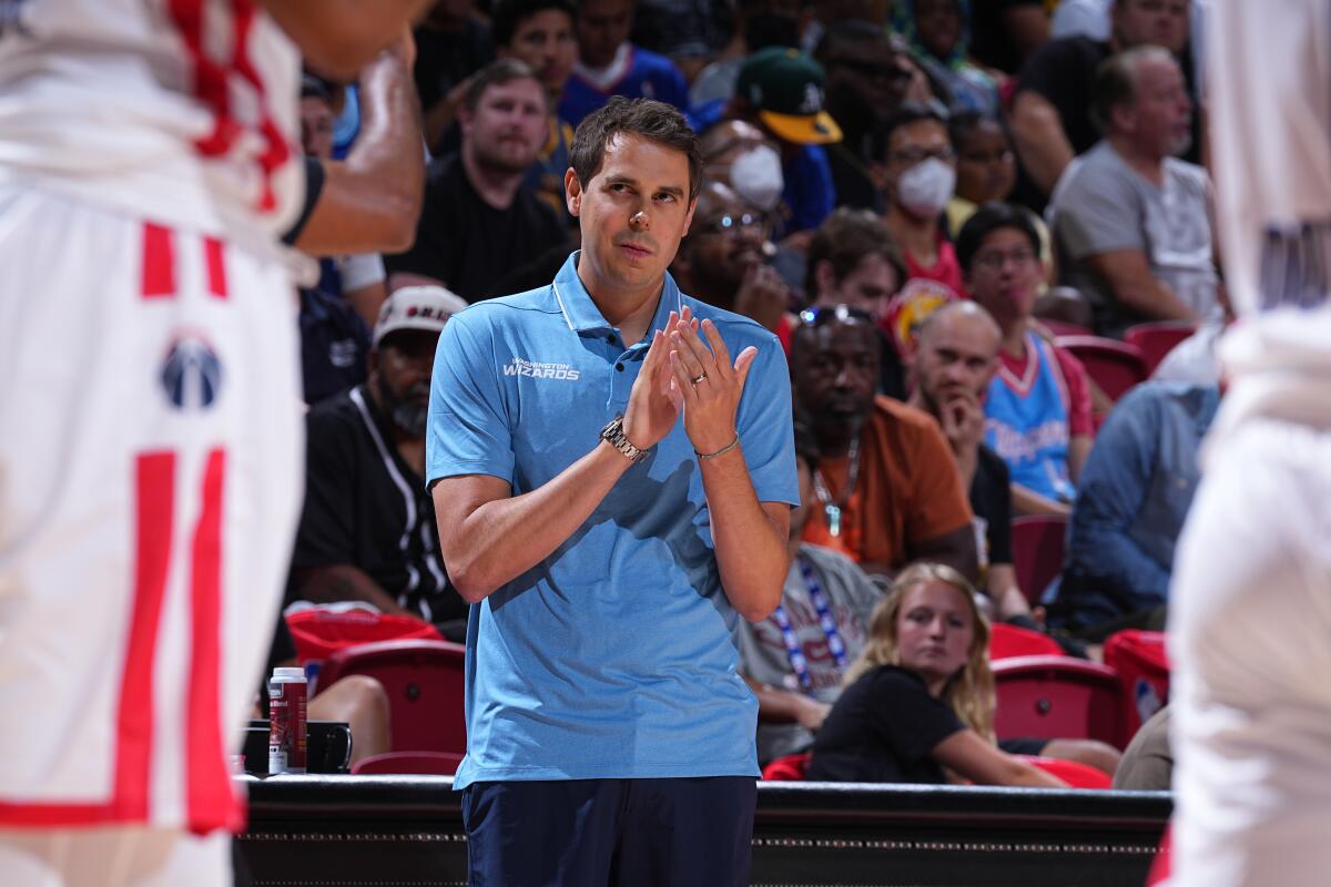 Zach Guthrie claps his hand in encouragement for the Wizards team during a 2022 Las Vegas Summer League game.