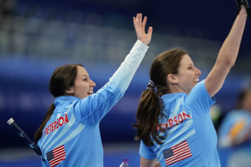 The United State's Tabitha Peterson waves to the crowd after a win against Russian Olympic Committee during a women's curling match at the Beijing Winter Olympics Thursday, Feb. 10, 2022, in Beijing. (AP Photo/Brynn Anderson)