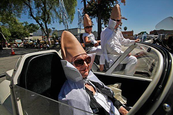 Dale Smith, 70, of Costa Mesa and other "Coneheads" take part in the 34th Occasional Pasadena Doo Dah Parade, whose offbeat and zany pageantry proceeded down Colorado Boulevard.