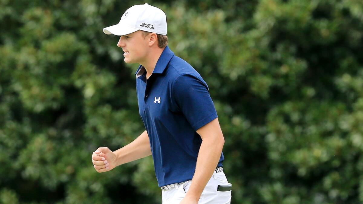 Jordan Spieth reacts after making a long birdie putt at No. 11 during the final round of the Tour Championship on Sunday at East Lake Golf Club.