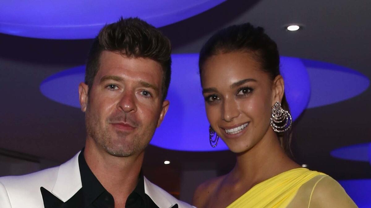 Robin Thicke and April Love Geary.