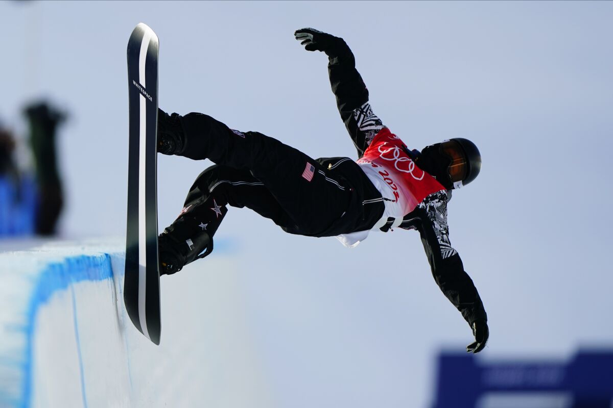 Shaun White competes during the men's halfpipe final at the Beijing Olympics on Friday.