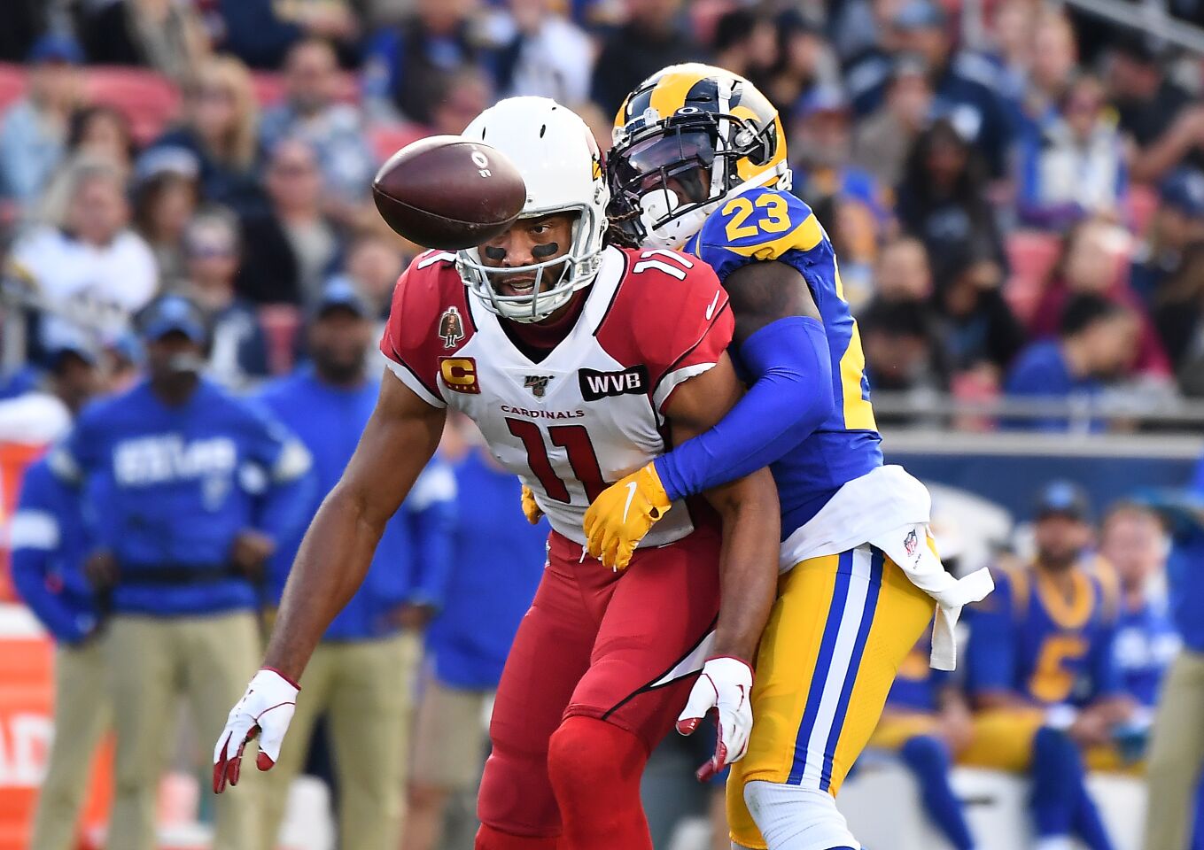 Rams cornerback Nickell Robey-Coleman prevents Cardinals receiver Larry Fitzgerald from making a catch during the second quarter.