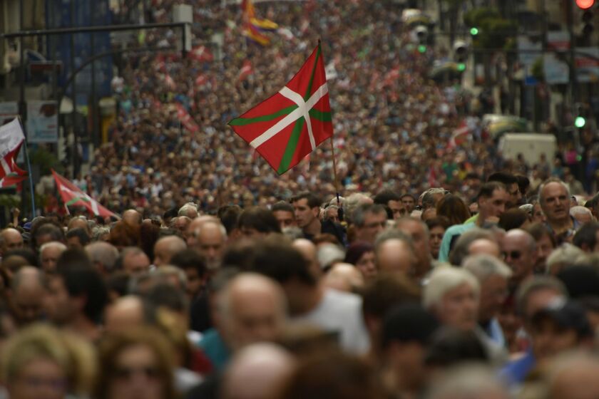Several thousand protestors march in the northern Spanish city of Bilbao, northern Spain, Saturday, April 21, 2018, to demand that imprisoned members of the militant Basque group ETA be moved to prisons closer to their homes. Saturday's demonstration comes a day after ETA made an unprecedented apology for some of the more than 850 people it killed during a four-decade armed campaign for independence of the Basque region from Spain and France. Hundreds of members of ETA are kept in Spanish and French prisons, mostly outside the Basque region. (AP Photo/Alvaro Barrientos)