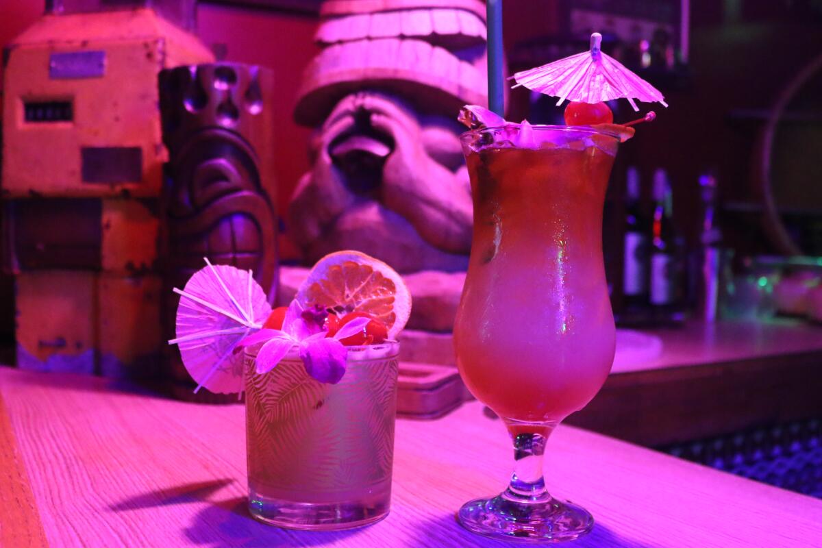 Two cocktails under the neon lights at Kahuna Tiki 