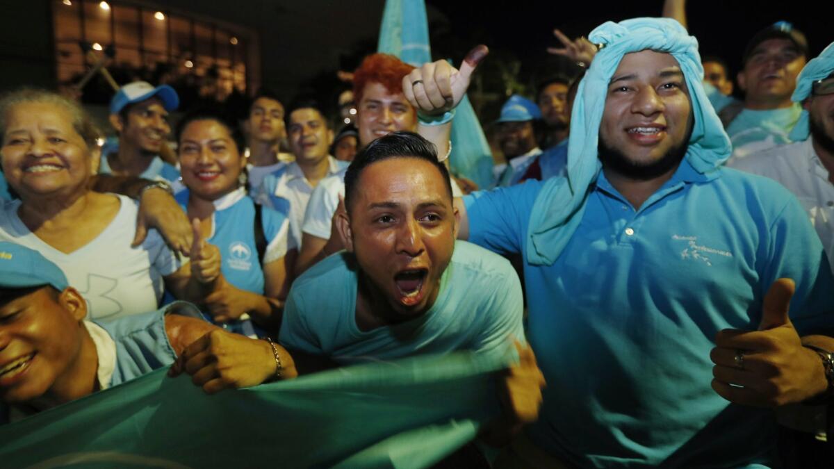 Supporters of the Grand National Alliance for Unity cheer for their presidential candidate Nayib Bukele in San Salvador on Feb. 3, 2019.