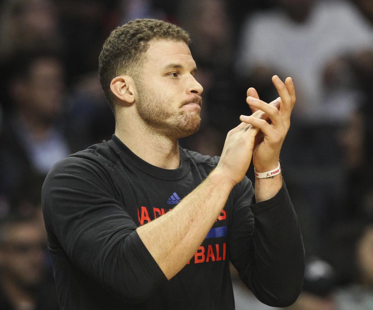 Blake Griffin watches the Clippers play New Orleans on Dec. 10.