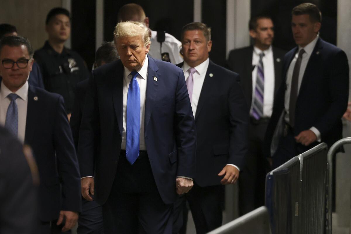 Former president Trump leaves Manhattan criminal court  in New York on Monday. 