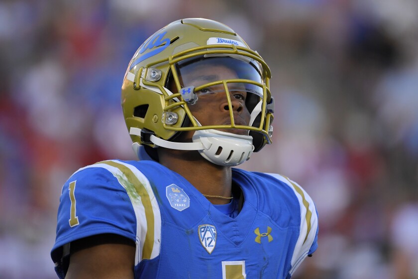 UCLA quarterback Dorian Thompson-Robinson stands on the field during Saturday’s loss to Oklahoma.