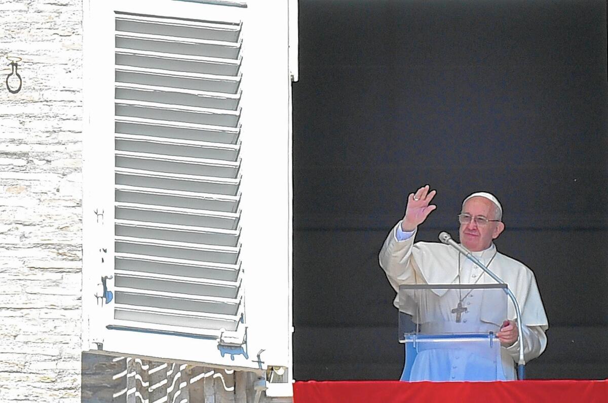 Pope Francis blesses the faithful during the Regina Coeli prayer from the window of his office in Saint Peter's Square, Vatican City, on April 10.