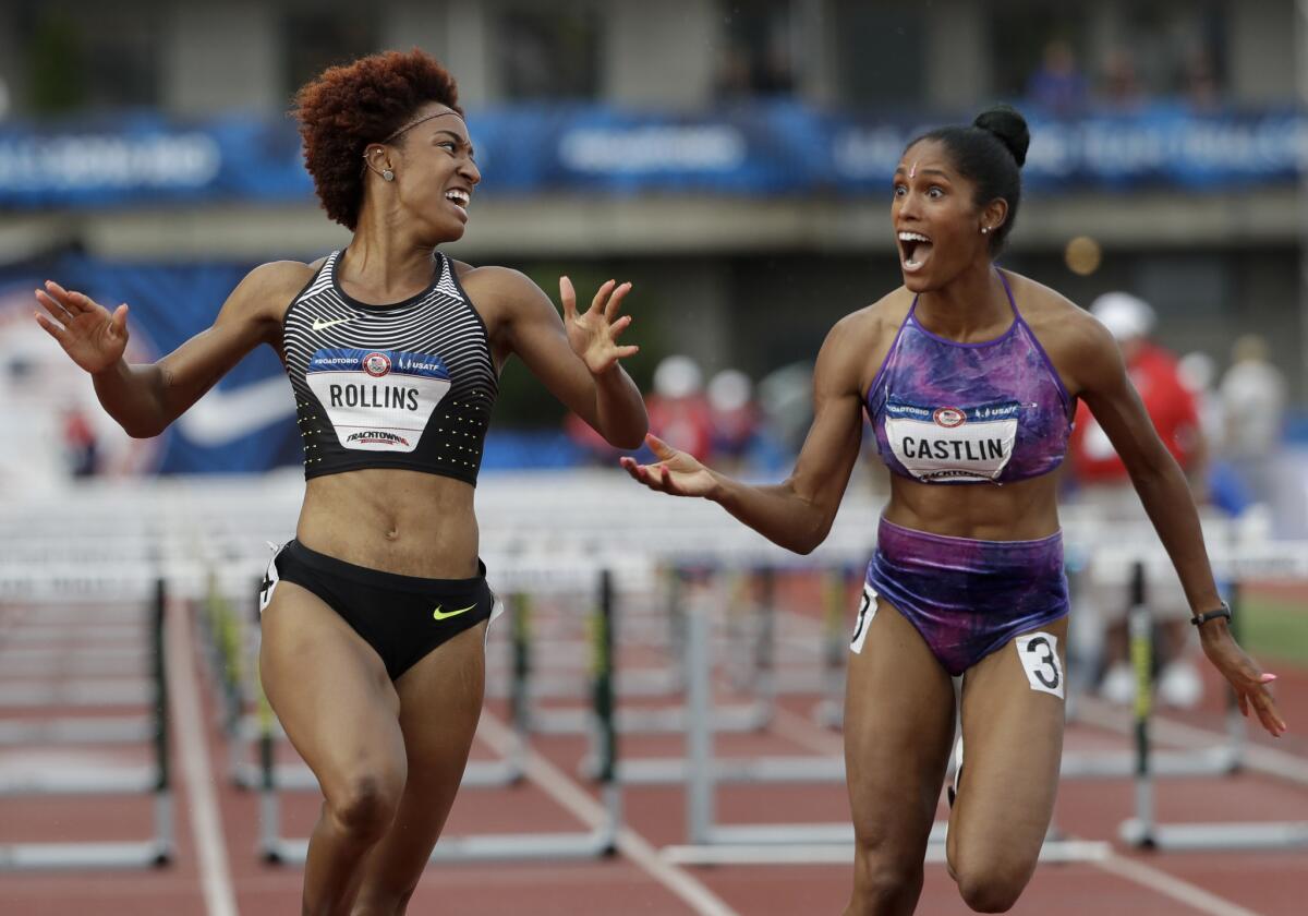 Brianna Rollins, left, celebrates her win with second-place finisher Kristi Castlin during the final of the women's 100-meter hurdles at the U.S Olympic track and field trials on July 8.