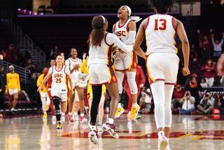 LOS ANGELES, CA - JANUARY 15: USC Trojans guard Okako Adika (24) and Kayla Williams (4) celebrates.